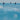 People surfing on a blue ocean with the word 'DRIFT' overlaid.