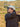 Man holding a golf club in an outdoor setting